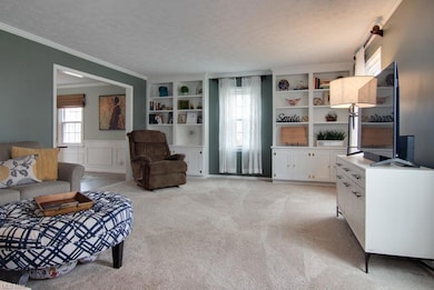 Spacious Living Room with built in bookshelves.