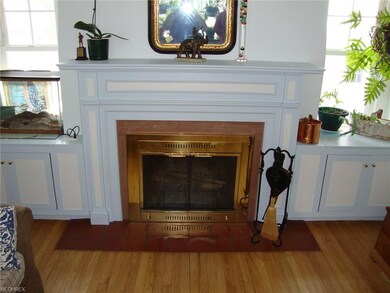Wood Burning Fire Place and custom Built-In Cabinets.