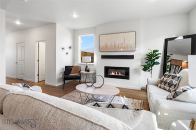 Living room with hardwood / wood-style flooring
