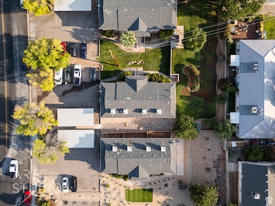 Aerial view of property's location featuring nearby suburban area