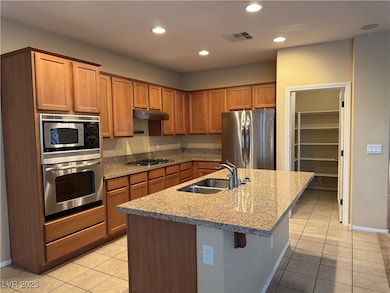 Kitchen with appliances with stainless steel finis