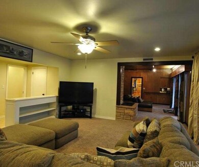 Formal Living Room with ceiling fan.