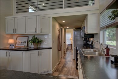 Kitchen featuring tasteful backsplash, sink, and w