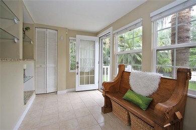 Front Florida room tiled with windows and blinds