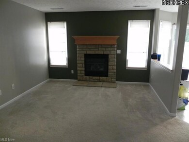 The great room featuring a beautiful gas fireplace.