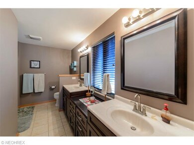 Partial view of Master Bath, features dual sinks &