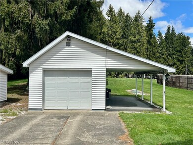Garage featuring a yard