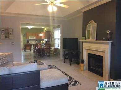 Tray ceilings, crown moulding, ceiling fan, and wo