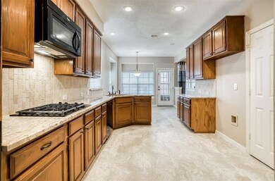The kitchen also features a walk-in pantry and lar