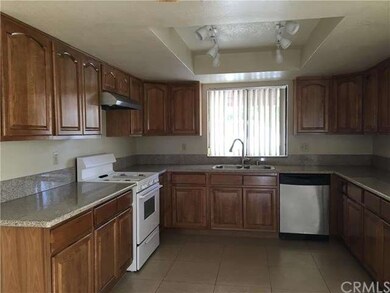 kitchen with granite counter top, maple wood cabin