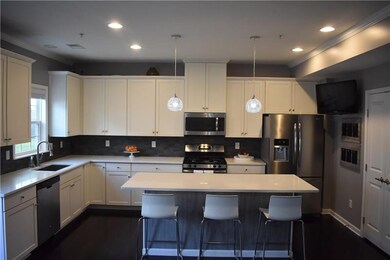 Large kitchen with quartz counter tops, over sized