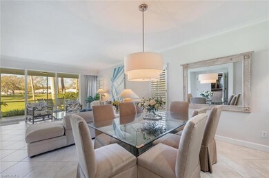 Tiled dining room with crown molding