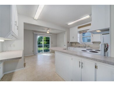 The kitchen features a built-in desk.
