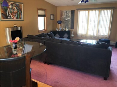 Open Layout Living Room With A Cathedral Ceiling.