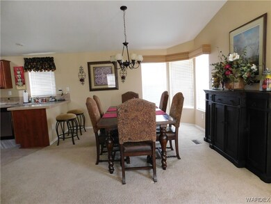 Dining room featuring a kitchen breakfast bar, nat