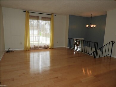 Open and bright living room with engineered wood f