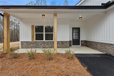 View of exterior entry with stone siding