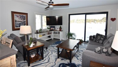 Open concept living room with patio doors to the l