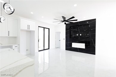 Kitchen featuring white cabinetry, recessed lighti
