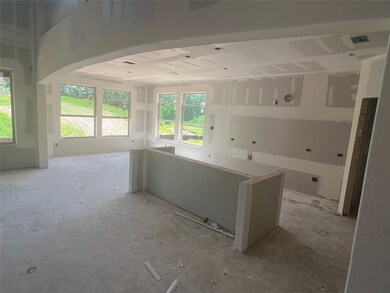 Gourmet island kitchen and charming dining area -