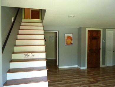 Entrance to finished lower level and stairs up to 
