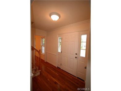 The entrance of the home features newly finished h