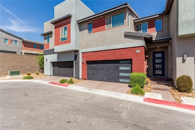 Modern home with an attached garage, driveway, fen