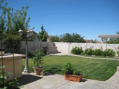 The outdoor lighting invites you to linger on those warm summer evening.  The yard is well established with automatic sprinkler system.