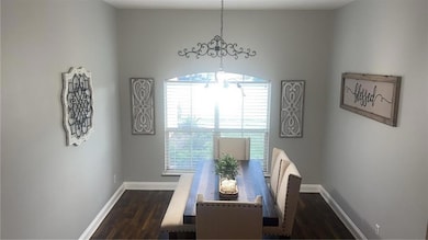Unfurnished dining area with an inviting chandelie