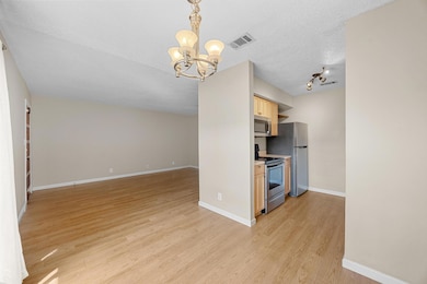 Kitchen with stainless steel appliances, a chande