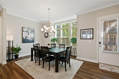 Dining space featuring dark wood-type flooring, an