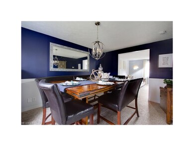 Dinning room with new floors and lighting.