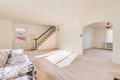 The living room flows into the dining room and has