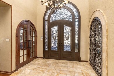 Grand front entryway of home with custom wood work