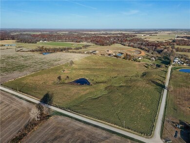 Aerial overview of property's location featuring a large body of water and rural landscape