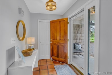 Foyer entrance with tile patterned floors