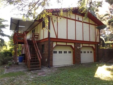 Rear covered porch and patio facing the small cree