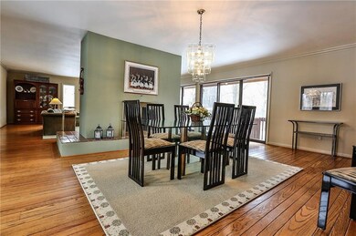 Beautiful hardwoods grace the dining room. Plenty 