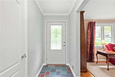 Greet guests in the sunny foyer with original slat