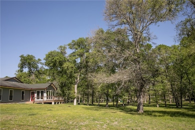 View of yard with a wooden deck