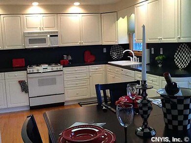 Kitchen. Notice the roomy dining area and shining 