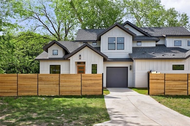 Modern inspired farmhouse with roof with shingles