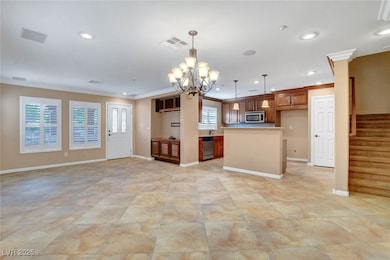 Kitchen with visible vents, hanging light fixtures