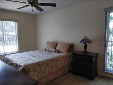 Master Bedroom with nice sized bedding, dresser, n