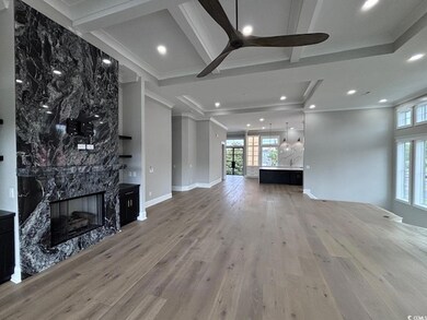 Unfurnished living room with hardwood / wood-style
