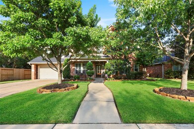 Beautiful curb appeal with large trees and nice flower beds.  A covered front porch welcomes visitors into this gorgeous home.