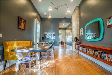 Dining room leading into kitchen and den features