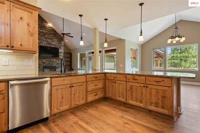 Kitchen looking into the living room and dining ar