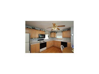 Kitchen. Oak cabinetry and hardwood floors.