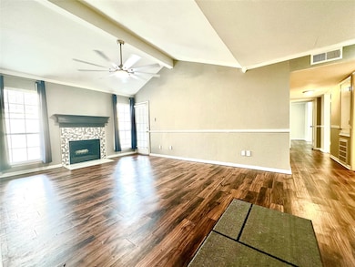 Modern-style living room with wood burning firepla